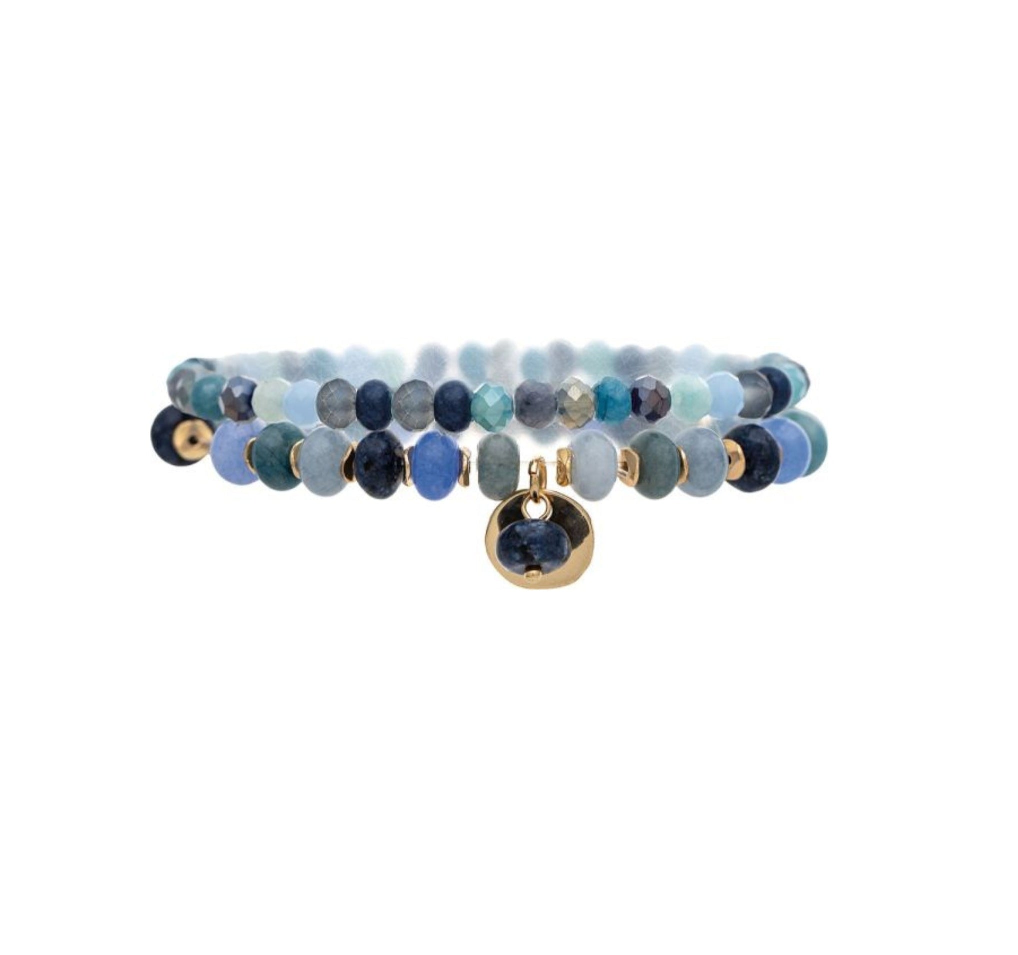 The A-Train Gold Blue Color Treated Jade Bead 2 Pc Set Bracelet features shades of blue and teal beads, gold accents, and a round gold charm with a blue stone at the center.
