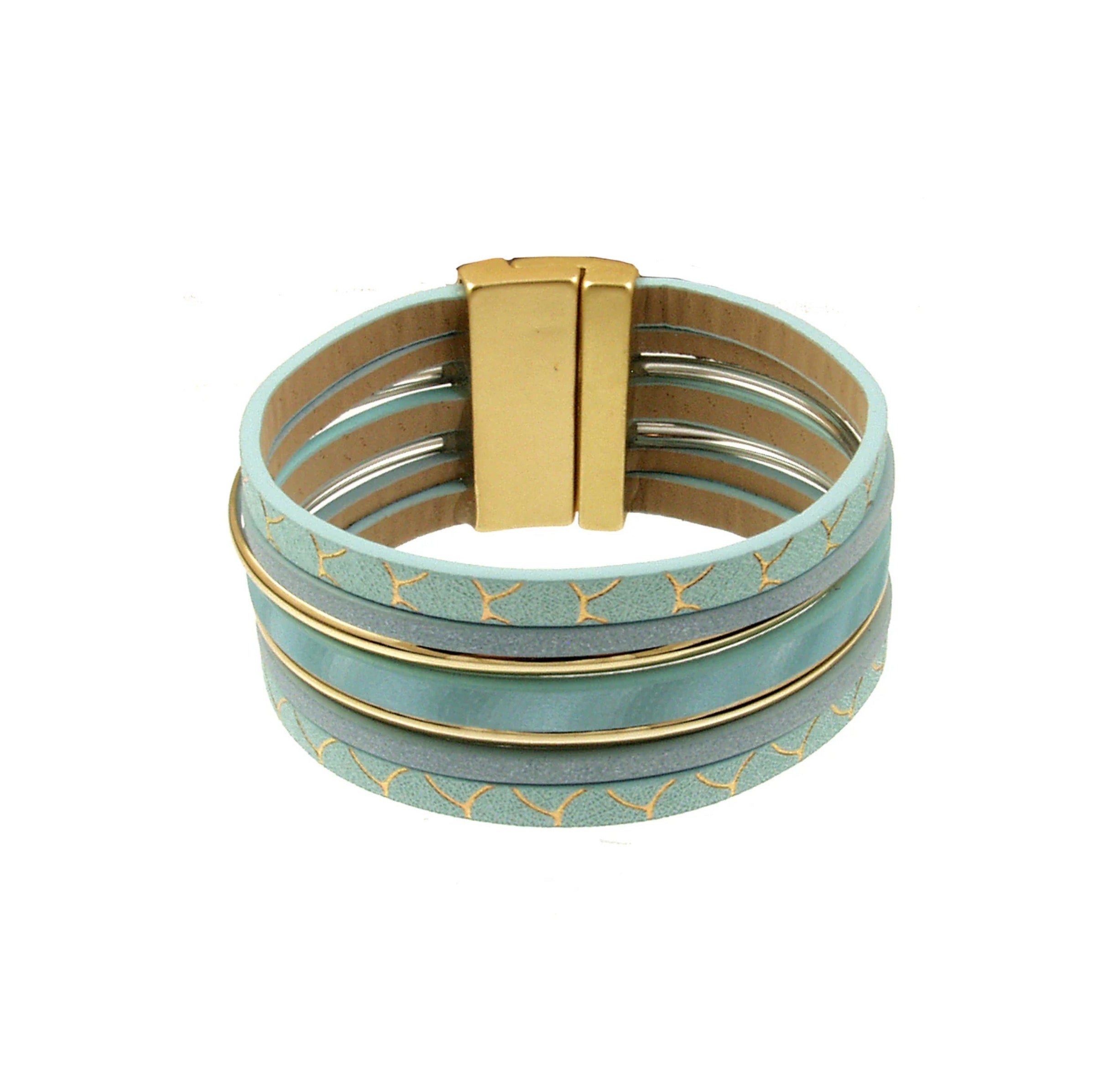The Origin Light Matte KC Gold & Aqua Magnetic Bracelet features wide, multi-strand aqua faux leather bands with KC gold accents, a rectangular gold clasp, and repeating gold whale tail patterns.