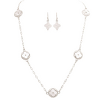 The A-Train Silver Mother-of-Pearl Clovers Necklace Set features five white floral pendants on a delicate mixed-metal chain, and includes matching drop earrings with the same elegant design.
