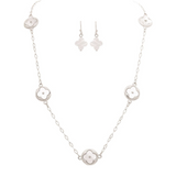 The A-Train Silver Mother-of-Pearl Clovers Necklace Set features five white floral pendants on a delicate mixed-metal chain, and includes matching drop earrings with the same elegant design.