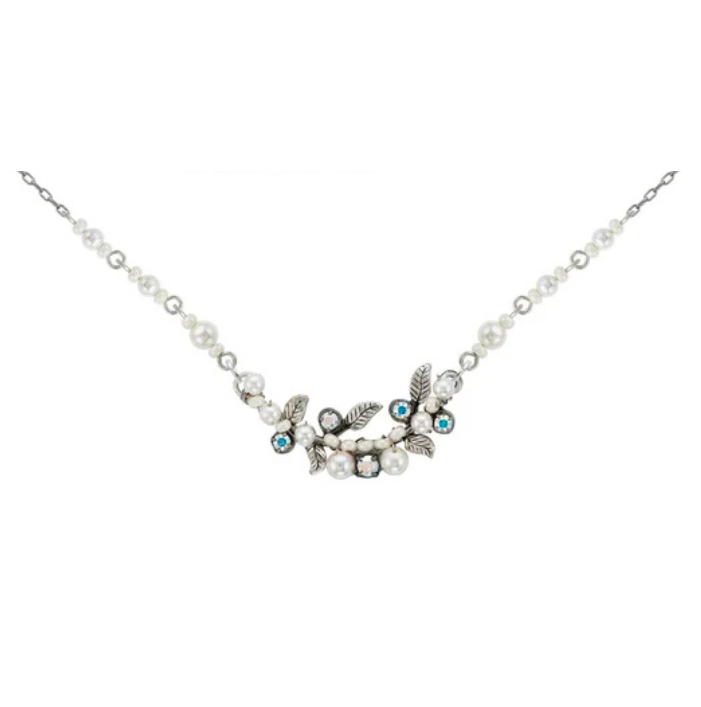 The Petite Flora W/ Glass Pearls White Necklace by Firefly is a delicate piece of handmade jewelry featuring silver leaves, small white glass pearls, and blue gemstones on a thin silver chain.