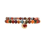 The A-Train Gold Pink Color Treated Jade Bead 2 Pc Set Bracelet features faceted multicolored beads and a gold-toned round charm with a red accent, perfect for pairing for a chic, coordinated look.