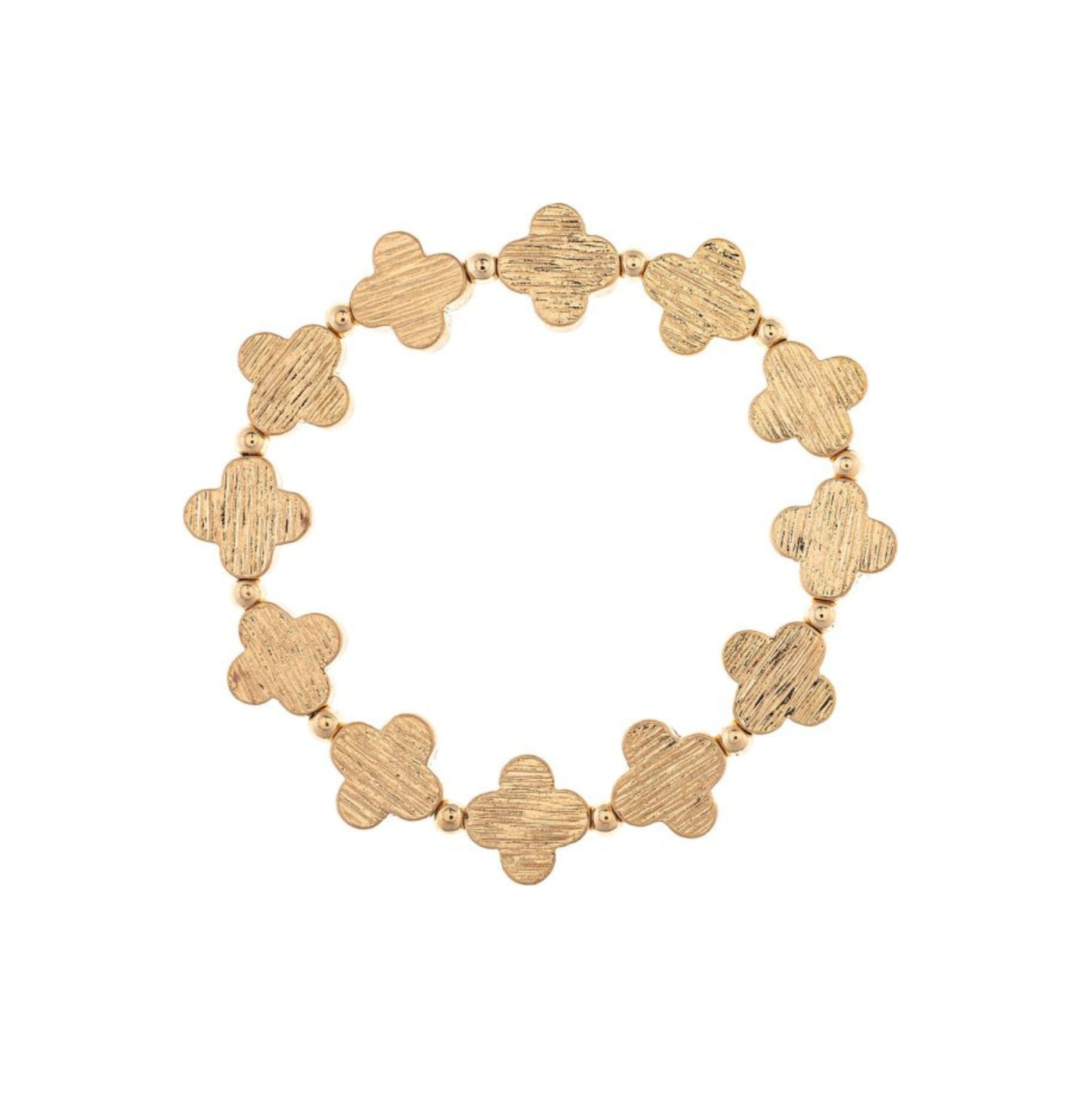 The A-Train Gold Line Etched Clovers Stretch Bracelet features textured four-leaf clover links and small round beads in a stylish circular pattern—ideal for everyday wear.