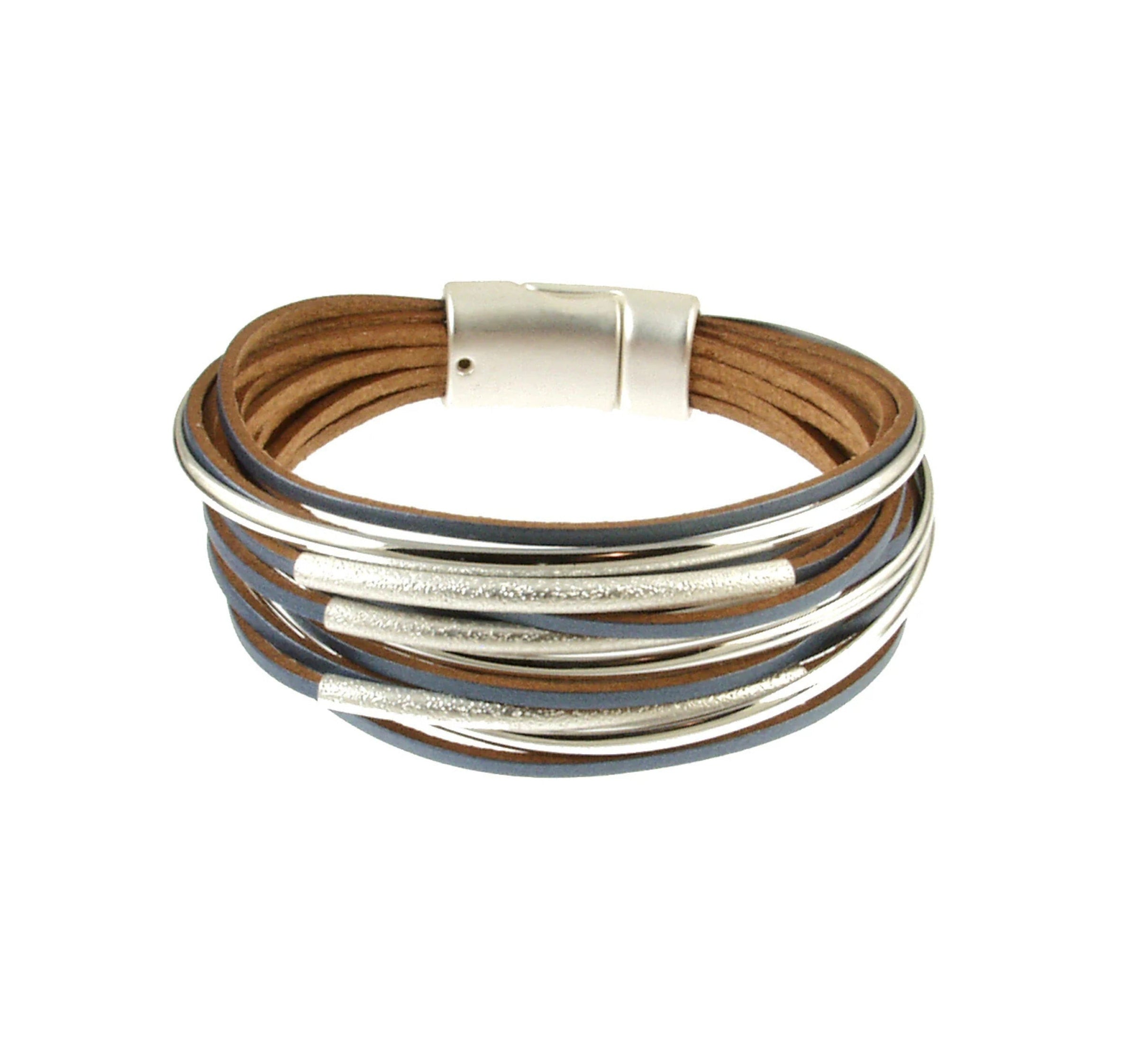 The Origin Matte Silver/Navy Multi Magnetic Bracelet features navy leather with curved matte silver tubes and a secure magnetic clasp for a stylish, layered look.