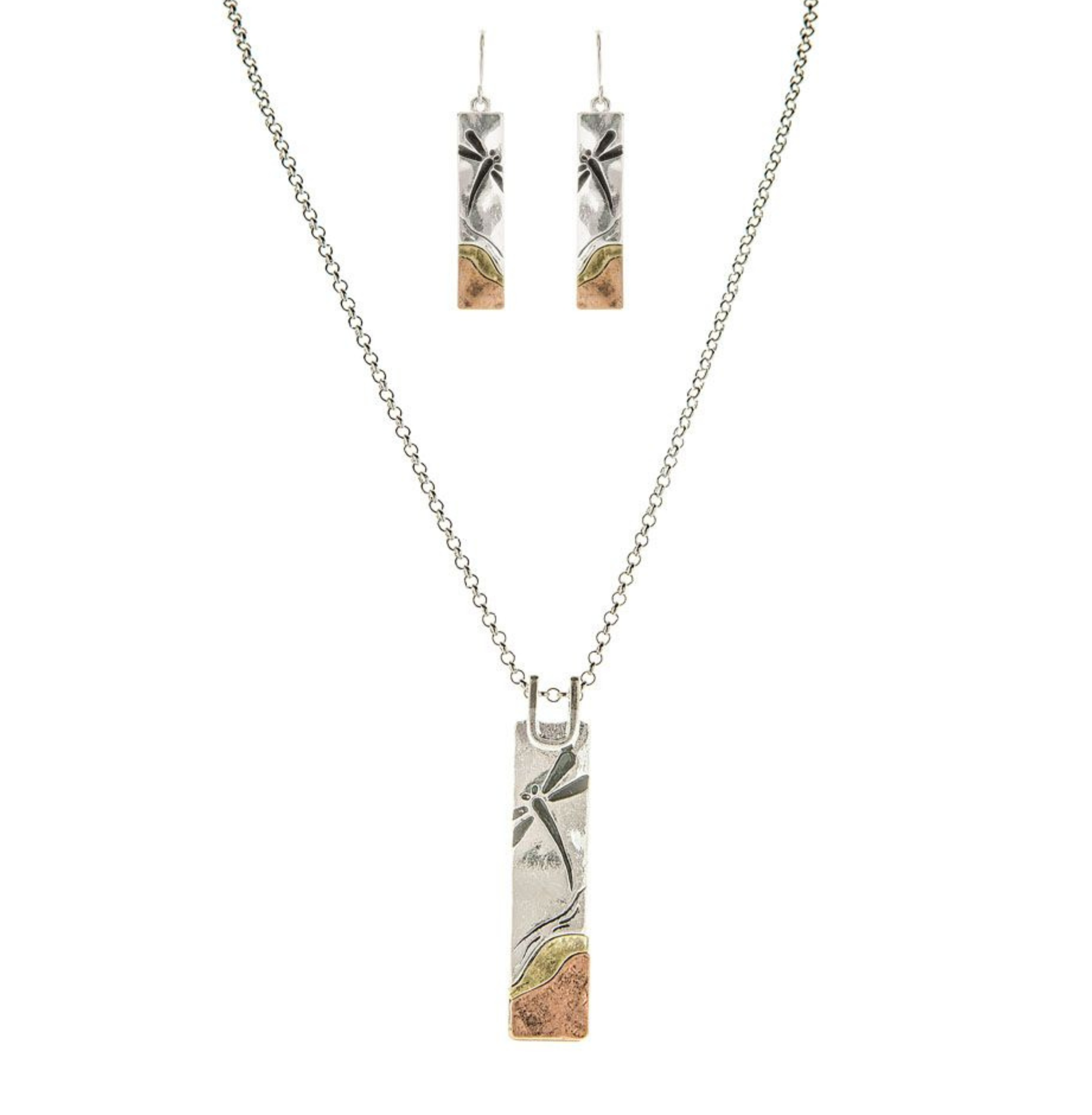 The A-Train Multi Metal Dragonfly Landscape Necklace Set features matching necklace and earrings with rectangular silver-tone pendants, etched with a nature-inspired design and accented with gold and copper details.