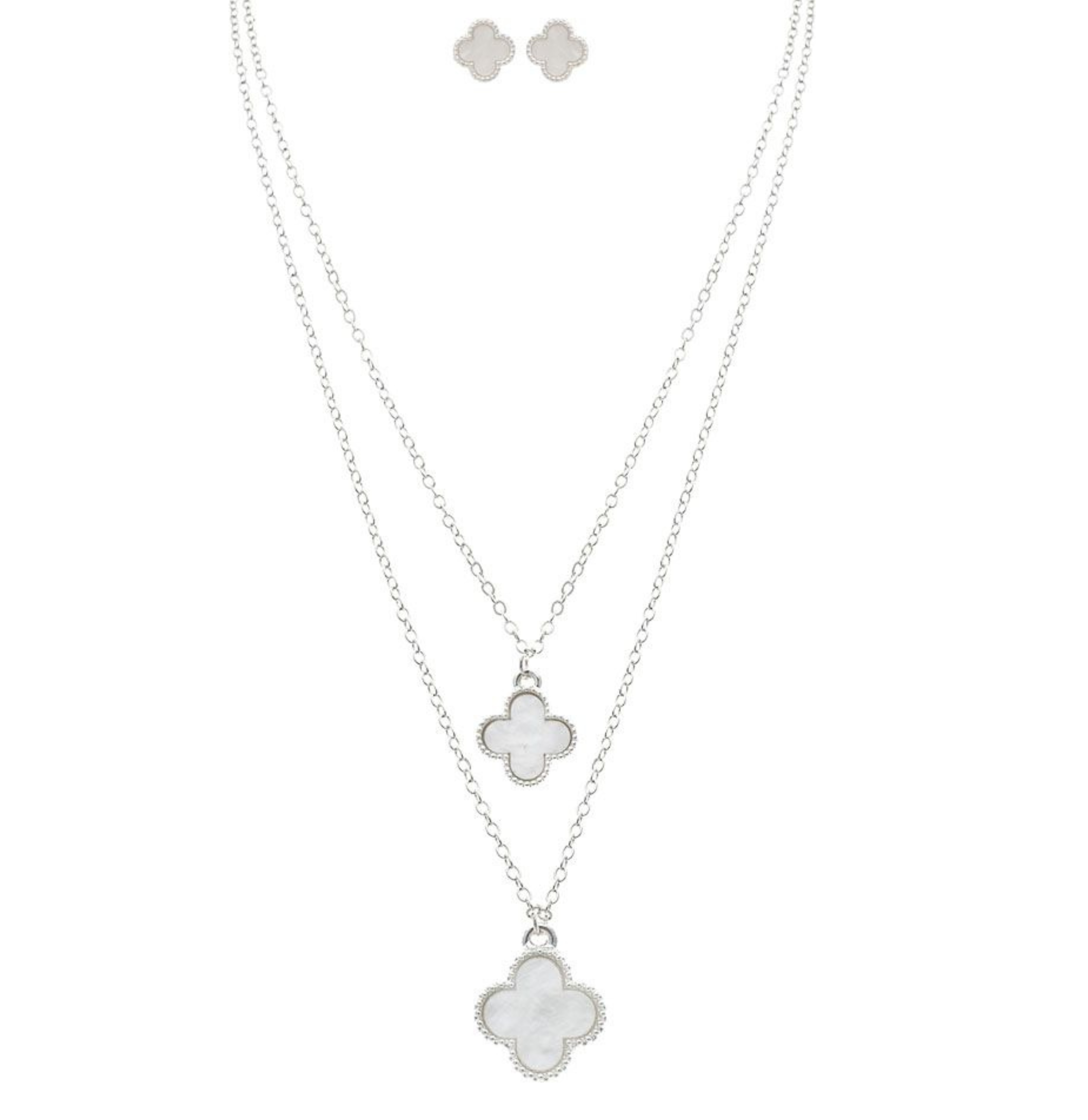 Explore the A-Train Silver White Layered Clover Necklace Set, featuring a stylish layered necklace and matching clover stud earrings crafted from mixed jeweler’s metals, all on a sleek white background.