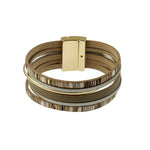 The Origin Shiny Gold/Stripe Print Magnetic Bracelet features multiple leather strands, metallic accents, and a rectangular gold magnetic clasp in beige and gold tones for a modern, stylish look.