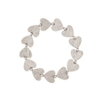 The A-Train Silver Line Etched Hearts Stretch Bracelet features silver heart-shaped links and small beads in a flexible, easy-to-wear design.