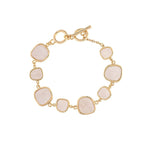 The A-Train Gold White Inlay Squares Toggle Clasp Bracelet features seven uniquely shaped white inlay squares set in gold bezels, giving a modern edge to classic elegance.