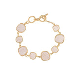 The A-Train Gold White Inlay Squares Toggle Clasp Bracelet features seven uniquely shaped white inlay squares set in gold bezels, giving a modern edge to classic elegance.