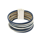 The Origin Matte Silver & Blue Magnetic Bracelet features multiple blue faux leather bands, matte silver-toned accents, and a secure rectangular magnetic clasp for a stylish look.