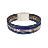 The Origin Matte Silver, Navy & Crystals Magnetic Bracelet features navy faux leather bands, gold accents, clear rhinestones, and a rectangular silver magnetic clasp.