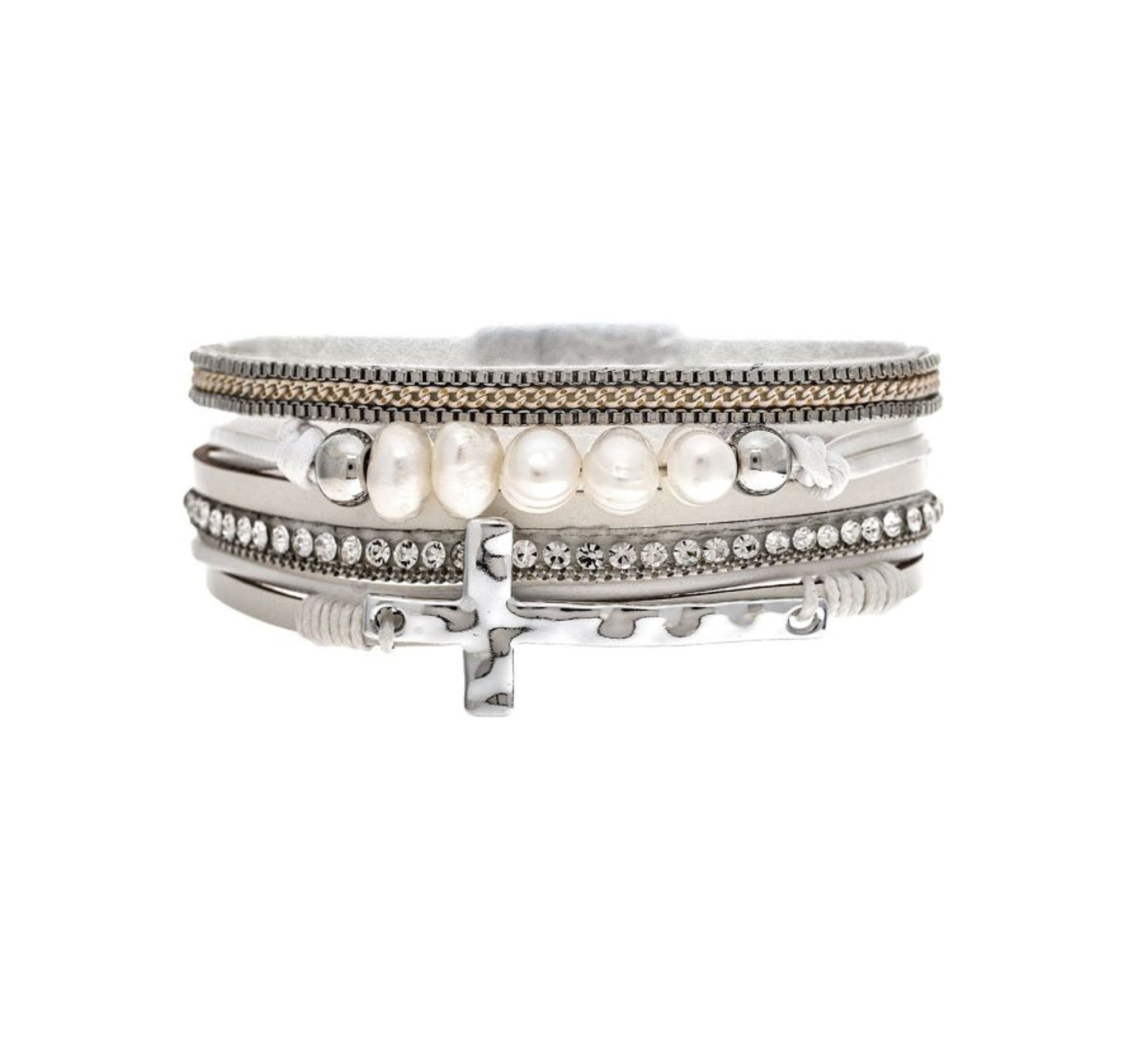 The A-Train Silver White Pearl Crystal Side Cross Magnetic Bracelet features silver bands, white pearls, crystal accents, and a side cross charm in a stylish stacked design.