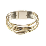 The Origin Shiny Gold Strand/Silver Circle Focal Magnetic Bracelet features shiny gold strands, silver metal bands, a rectangular clasp, and a bold silver circle centerpiece.