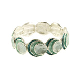 The Origin Silver Layered Aqua Circle Bracelet showcases overlapping round discs with green and light blue enamel accents, offering a versatile and elegant design perfect for any occasion.