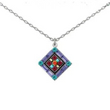 Adorn yourself with the La Dolce Vita Diamond Multi-Color necklace from Firefly—a silver chain featuring a diamond-shaped pendant inlaid with purple, blue, red, and green gemstones arranged in a striking geometric design. Handcrafted in Guatemala, this piece of fair-trade jewelry exemplifies Firefly’s artistry and vibrant elegance.