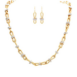 The A-Train Two-Tone Infinity w/Circles Chain Link Necklace Set features gold and silver links with matching dangle earrings, highlighting mixed metals against a crisp white background.