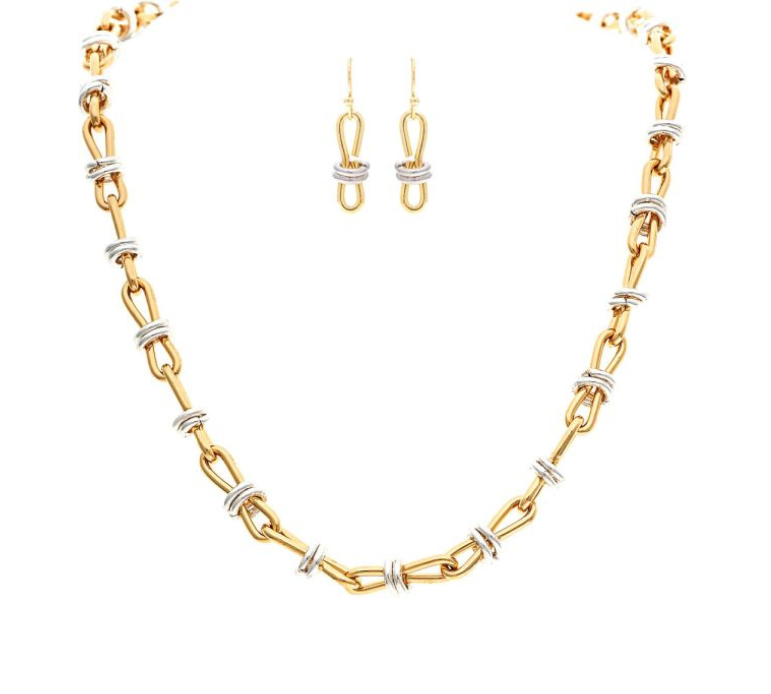 The A-Train Two-Tone Infinity w/Circles Chain Link Necklace Set features gold and silver links with matching dangle earrings, highlighting mixed metals against a crisp white background.
