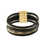The Origin Matte Gold & Black Print-6 Strand Magnetic Bracelet showcases multiple black leather strands, gold metallic accents, and a wide magnetic clasp in a modern, layered design.