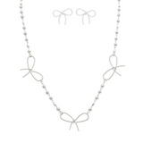 The A-Train Silver Faux Pearl Link Bow Stations Necklace Set features three wire bow designs with small silver faux pearl beads, paired with matching bow-shaped earrings.