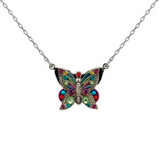 The Filigree Butterfly Multi-Color Necklace by Firefly Jewelry features a silver chain and a jeweled butterfly pendant adorned with vibrant red, pink, green, and blue accents—making this handmade Firefly piece a stunning and colorful addition to any outfit.