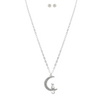 The A-Train Silver Cat in Crystal Crescent Moon Necklace Set features a playful cat on a crystal crescent moon with matching round stud earrings, beautifully displayed on a white background.