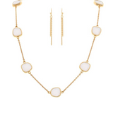 A-Train’s Gold White Square Stations Chain Necklace Set features cushion-cut gemstones and matching gold drop earrings with delicate chains, offering a refined, modern minimalist look.