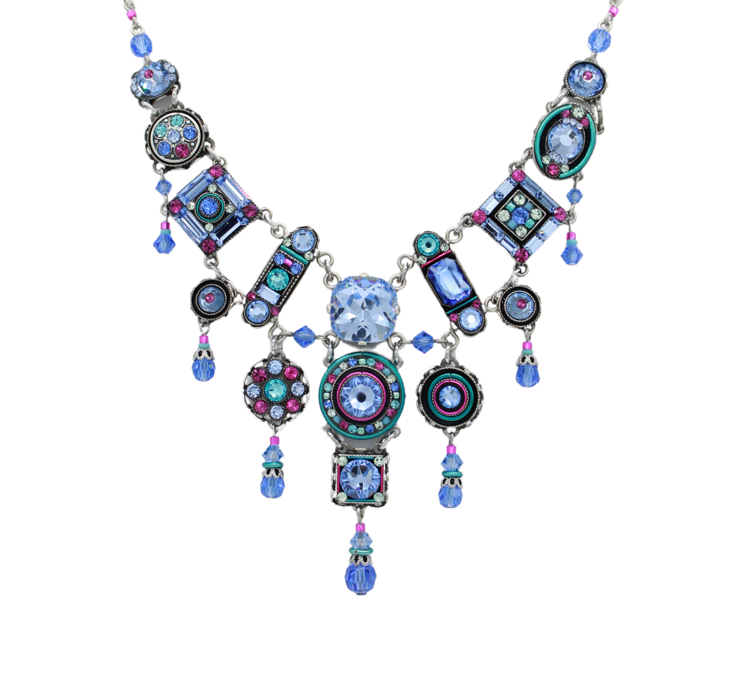 The La Dolce Vita Bib Light Blue Necklace by Firefly features geometric shapes in light blue with intricate patterns and crystals on a silver chain, showcasing stunning fair-trade craftsmanship.
