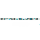 The Moonlight Bon Vivant Simple Bracelet Light Blue by Firefly is a stunning fair trade jewelry piece, featuring a handmade silver band adorned with turquoise and blue oval stones, decorative metalwork, small white beads, and a clasp with a blue charm—beautifully blending artisan craftsmanship with elegant design.