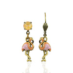 The Small Enamel Flamingo Drop Earrings by Anne Koplik Designs, Inc. feature pink flamingo charms with yellow gemstones above, hanging from gold hooks for a tropical look.