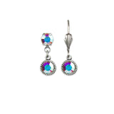 The Simple Drop Crystal Aurora Borealis Earrings by Anne Koplik Designs, Inc. feature iridescent blue and purple crystals set in silver-toned metal with a decorative textured hook and intricate detailing.