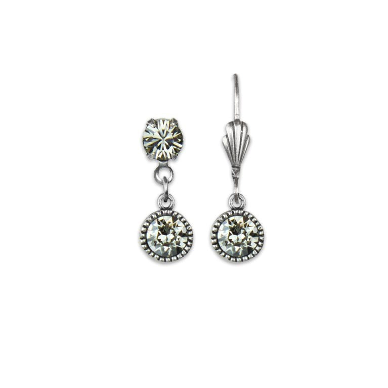 The Simple Drop Clear Crystal Earrings by Anne Koplik Designs, Inc. feature a silver-tone finish with clear round gemstones and a hook back—an elegant, timeless accessory for any occasion.