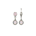 The Simple Drop Rose Opal Earrings by Anne Koplik Designs, Inc. feature a unique pair: one silver-toned earring has both top and hanging light pink gemstones, while the other displays just the top stone with a decorative hook for timeless style.
