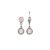 The Simple Drop Rose Opal Earrings by Anne Koplik Designs, Inc. feature a unique pair: one silver-toned earring has both top and hanging light pink gemstones, while the other displays just the top stone with a decorative hook for timeless style.