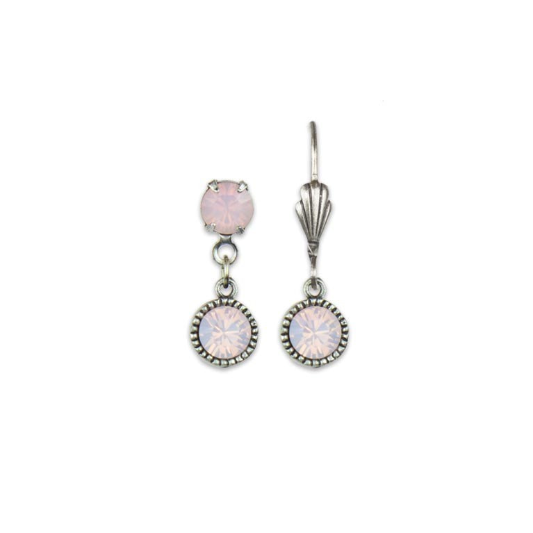 The Simple Drop Rose Opal Earrings by Anne Koplik Designs, Inc. feature a unique pair: one silver-toned earring has both top and hanging light pink gemstones, while the other displays just the top stone with a decorative hook for timeless style.