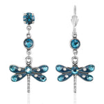 The Enamel & Stone Teal Dragonfly Earrings by Anne Koplik Designs, Inc. feature dragonfly pendants with blue stones and enamel accents. These lead- and nickel-free earrings are set on surgical steel posts for comfort.