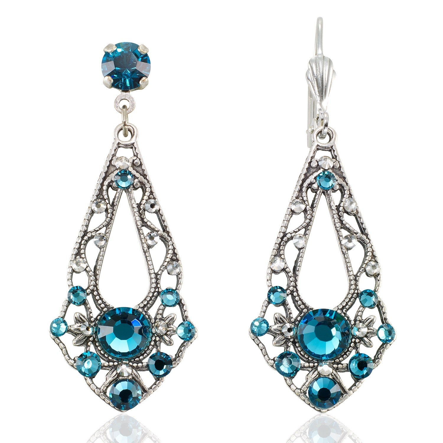 The Anne Koplik Designs, Inc. Open Leaf Pendulum Teal Earrings feature an ornate antiqued silver filigree design and symmetrically arranged round teal stones. Lead- and nickel-free for comfortable, stylish wear.
