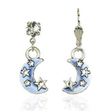 The Dream Stone/Enamel Blue Moon Earrings by Anne Koplik Designs, Inc. feature silver-plated crescent moons with clear gemstone studs, dangling moon charms adorned with small stars, and light blue hand-enameled accents.