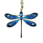 The Large Enamel/Stone Dragonfly Necklace by Anne Koplik Designs, Inc. features hand-enameled blue iridescent wings with black edges, blue crystal accents, and hangs from a gold chain—a dazzling statement piece.