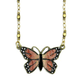 The Mini Monarch Butterfly Necklace by Anne Koplik Designs, Inc. features a gold chain and a hand-enameled pendant with orange and black wings accented by white spots—a beautiful piece of symbolic butterfly jewelry.