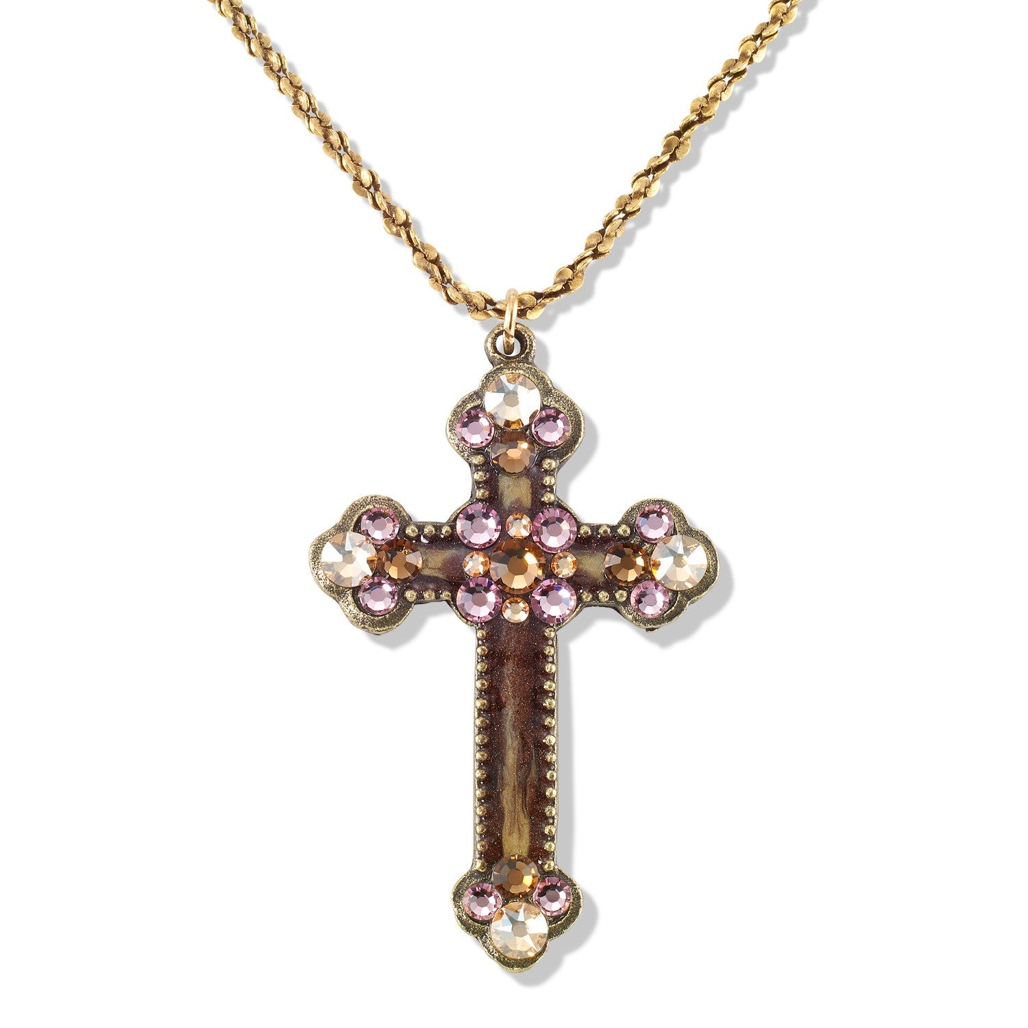 The Enamel & Stone Mocha/Lavender Cross Necklace by Anne Koplik Designs, Inc. features a gold, lead-free adjustable chain and a cross pendant adorned with pink and clear stones at each end and center.