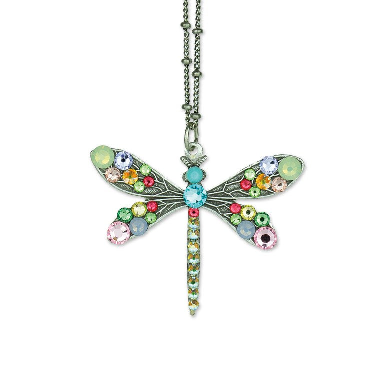 The Multi Stone Medium Dragonfly Necklace by Anne Koplik Designs, Inc. features a silver-plated chain with colorful gemstones in blue, pink, green, and yellow for a vibrant statement.
