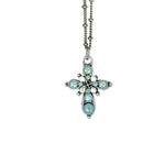 The Anne Koplik Designs Small Stone Fancy Cross Pacific Opal Necklace features a vintage silver cross pendant with blue and white gemstones, elegant crystal accents, and symmetrical detailing.
