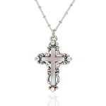 The Enamel & Stone Fancy Cross Pink Necklace by Anne Koplik Designs, Inc. features a pink-adorned cross pendant on an adjustable chain. This lead- and nickel-free piece is pictured on a white background, exuding timeless elegance and comfort.