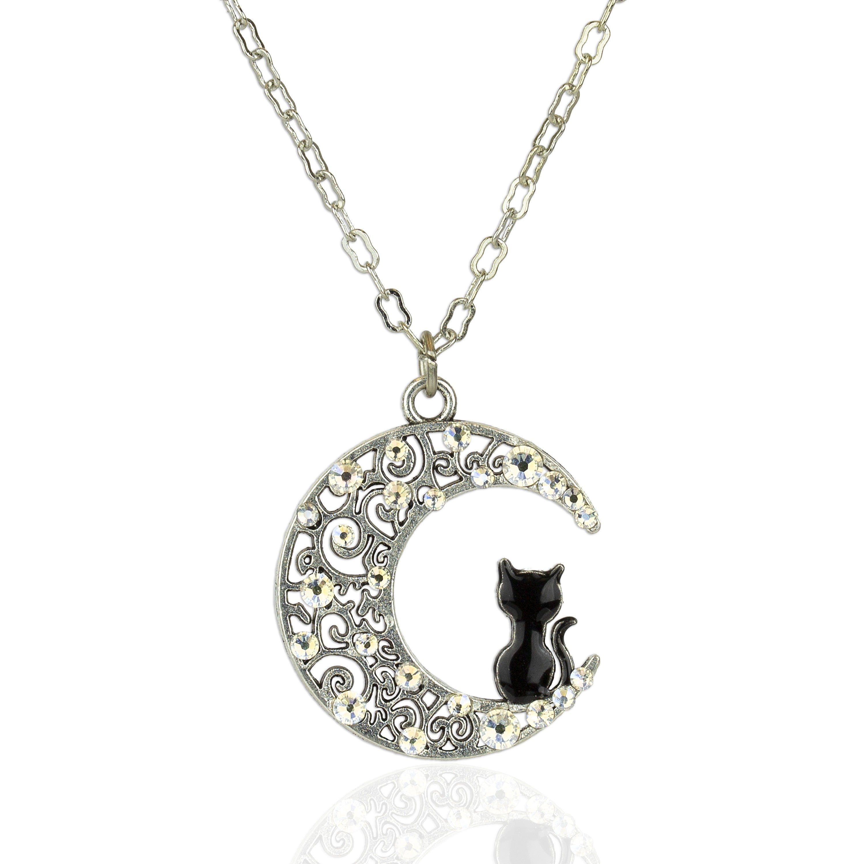 The Crescent Moon w/Black Cat Necklace by Anne Koplik Designs, Inc. features a crescent pendant with ornate swirls, sparkling crystals, and a black cat elegantly perched inside.