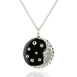 The Black & Crystal Crescent Moon Face w/Stars Necklace by Anne Koplik Designs, Inc. features a silver-plated brass round pendant with a crescent moon face, black enamel, sparkling rhinestones, and celestial crystal accents.