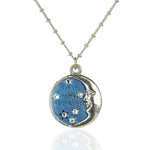 The Anne Koplik Designs, Inc. 1/2 Moon Face w/Stars "Moon and Back" Necklace features a silver celestial pendant with a half-moon face, blue and silver stars, crystal accents, and the phrase "I love you to the moon & back.