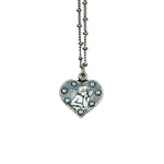 The Whimsey Angel Necklace by Anne Koplik Designs, Inc. features a heart-shaped angel pendant with a raised cherub and sparkling stones—a beautiful protective silver necklace for any occasion.