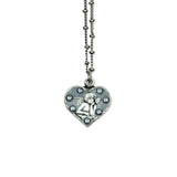 The Whimsey Angel Necklace by Anne Koplik Designs, Inc. features a heart-shaped angel pendant with a raised cherub and sparkling stones—a beautiful protective silver necklace for any occasion.